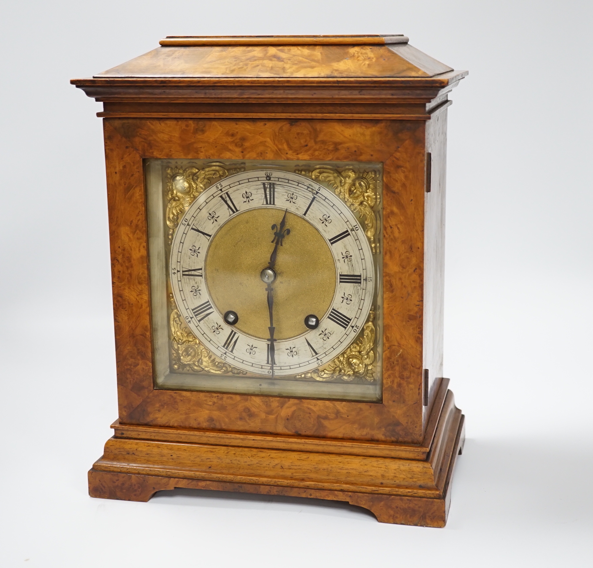 A German Lenzkirch burr walnut mantel clock striking on a coiled gong, 32cm high